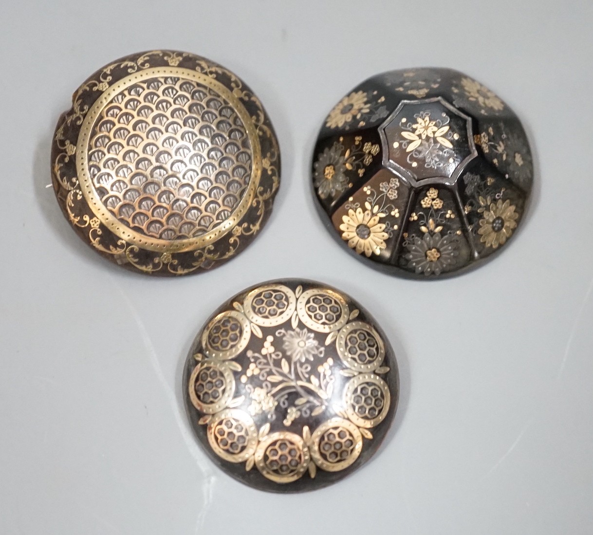 Three 19th century gold and silver pique work tortoiseshell brooches